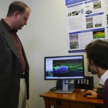 Jared Polis Views LiDAR data on a site tour