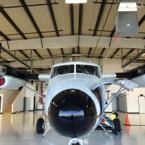 View of a twin otter from the nose in the hanger