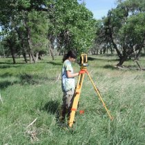 Field technician doing total station monitoring