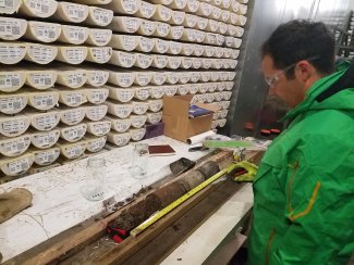 Coauthor Adrian Gallo looks at arctic soil core