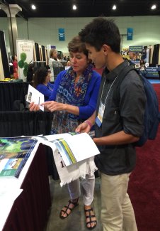 Liz Goehring explaining the benefits of NEON's undergraduate internship program to Paul Awo, from Kapi'olani Community College, Hawaii