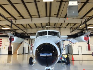 View of a twin otter from the nose in the hanger